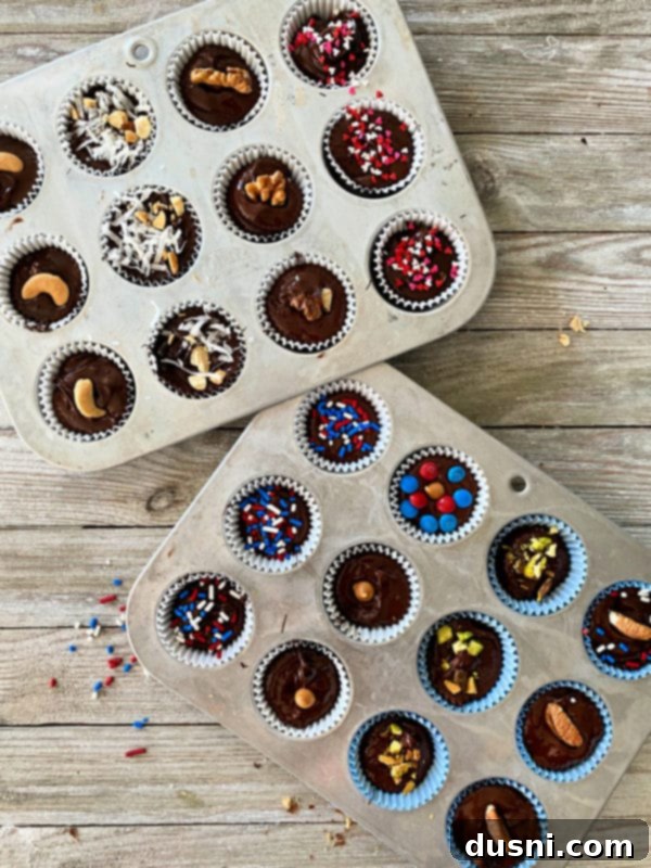 Decadent Homemade Chocolate Cups 7 Pouring melted chocolate into mini muffin liners with fillings