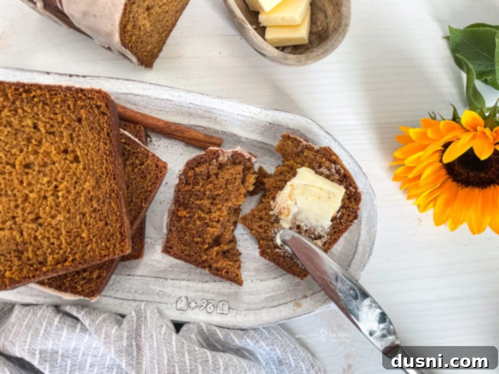 Slices of warm pumpkin bread with melted butter
