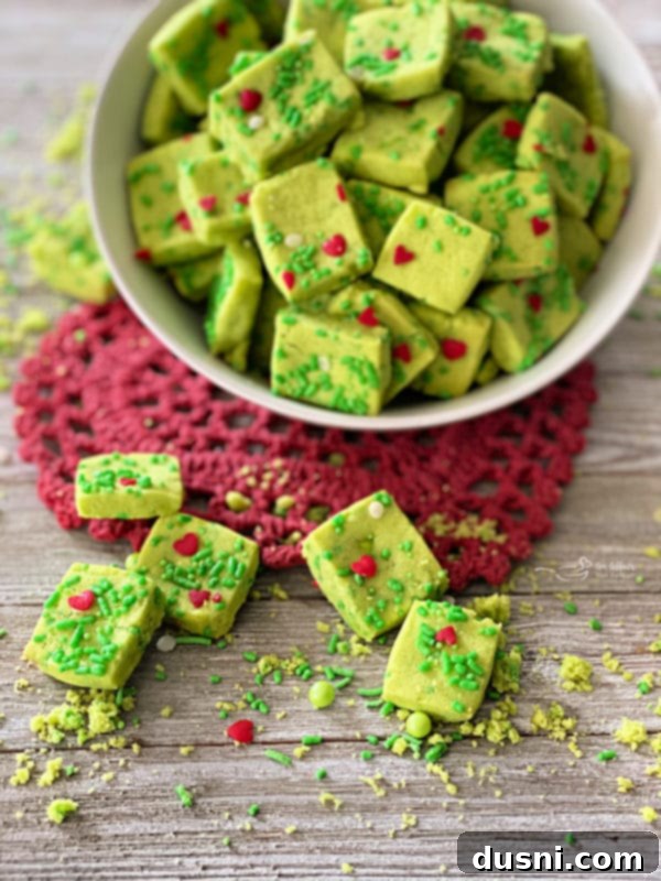 Grinch Shortbread Bites on a red heart shaped doily