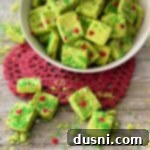 Grinch Shortbread Bites on a red heart shaped doily
