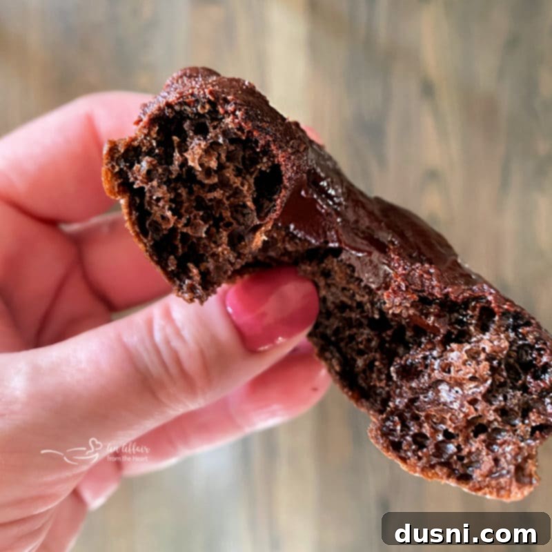 Close-up of baked chocolate kraut donuts with a perfect chocolate glaze.