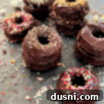 Baked chocolate kraut donuts stacked on a counter, ready to be enjoyed.