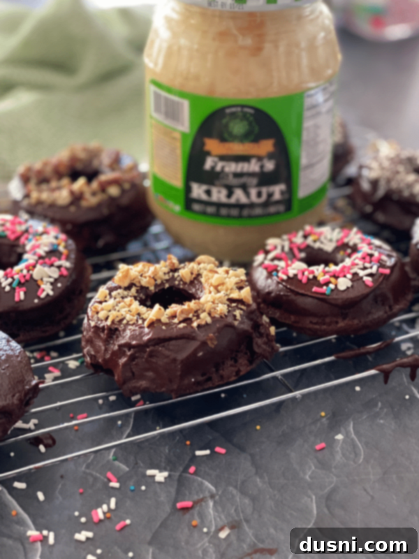 Close-up of baked chocolate kraut donuts, perfectly glazed with chocolate ganache.