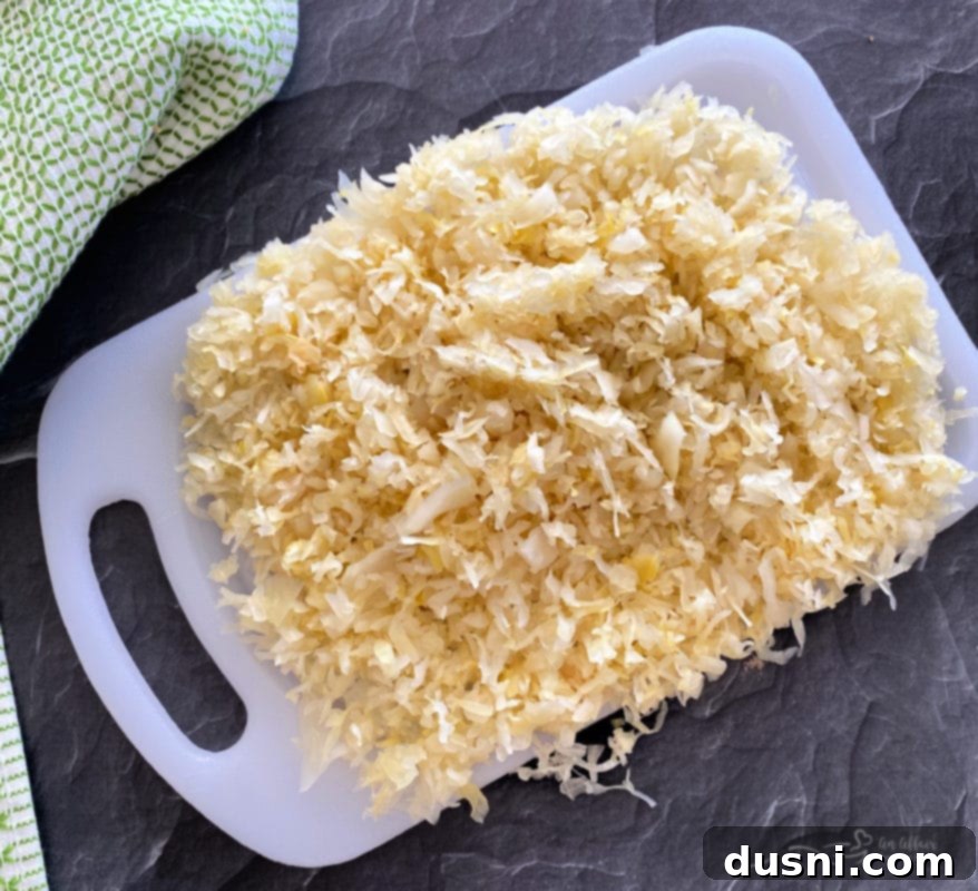 A close up shot of a single baked chocolate kraut donut, showing its fluffy texture and rich ganache topping.