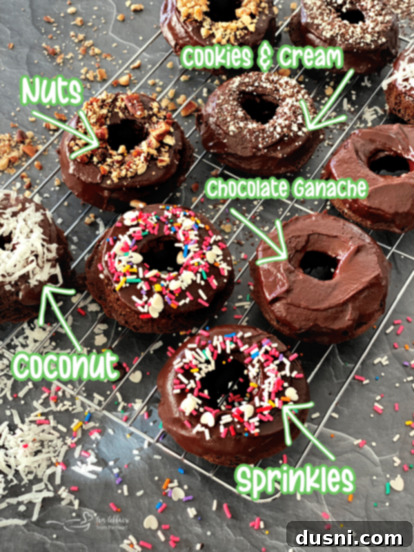 Assortment of decorated baked chocolate kraut donuts with various toppings.