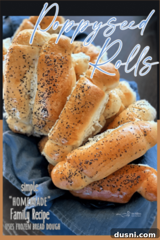 An overhead shot of a basket filled with golden-brown poppyseed rolls, inviting and delicious.