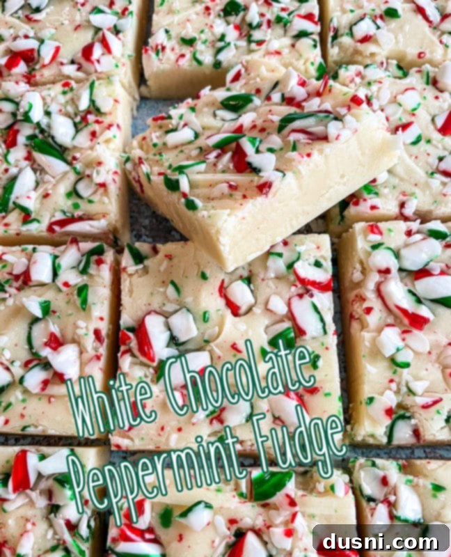 A large serving plate piled high with white chocolate peppermint fudge squares.