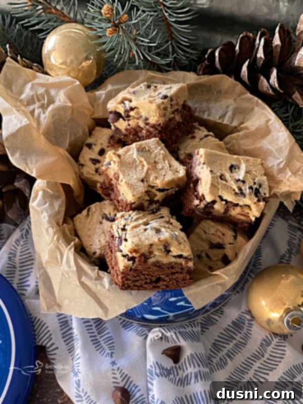 Cookie Dough Brownie Dream 2 Close-up of Chocolate Chip Cookie Dough Brownies, showing the fudgy brownie base and thick cookie dough topping with visible chocolate chips.