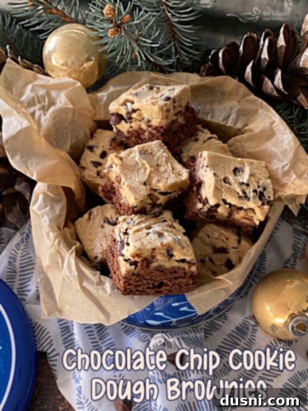 Cookie Dough Brownie Dream 18 Two Chocolate Chip Cookie Dough Brownies on a white plate with a festive napkin, ready to be enjoyed.