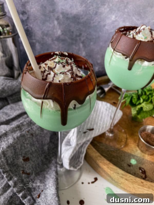 Two elegantly garnished Grasshopper Cocktails, a classic mint chocolate adult dessert.