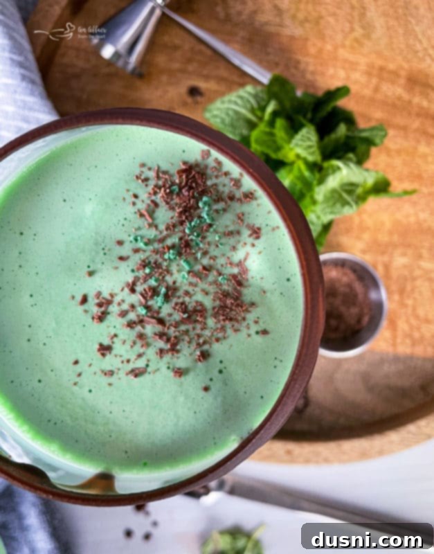 Blending the ingredients for a Grasshopper Cocktail until smooth and creamy.