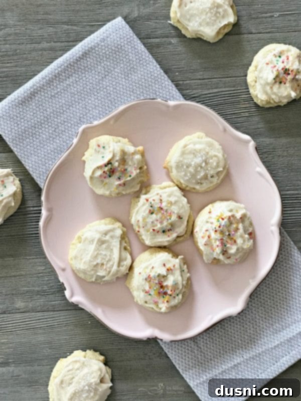 A close up of a Frosted Sour Cream Sugar Cookie, illustrating the appeal of traditional cookies.