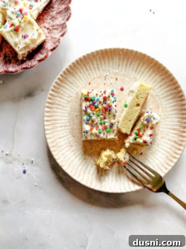 A tray of freshly baked Frosted Sugar Cookie Bars, ready to be cut and served.