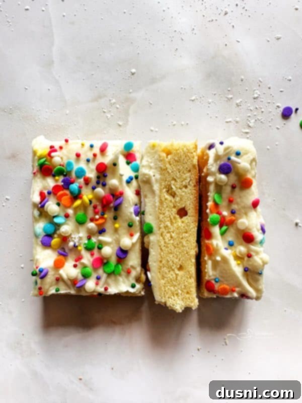 Close-up of a perfectly frosted sugar cookie bar slice.