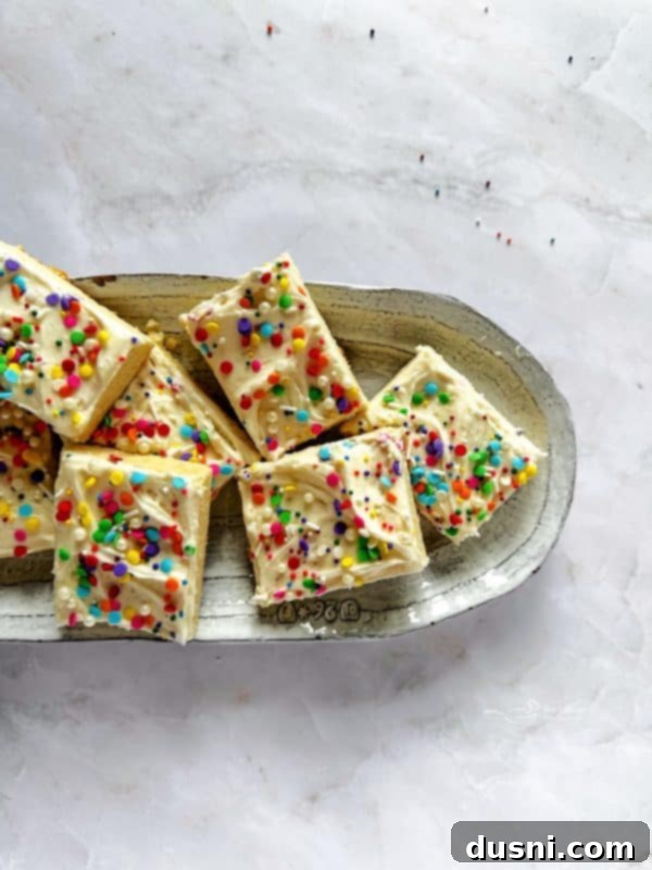 A platter showcasing a variety of beautifully decorated Frosted Sugar Cookie Bars.