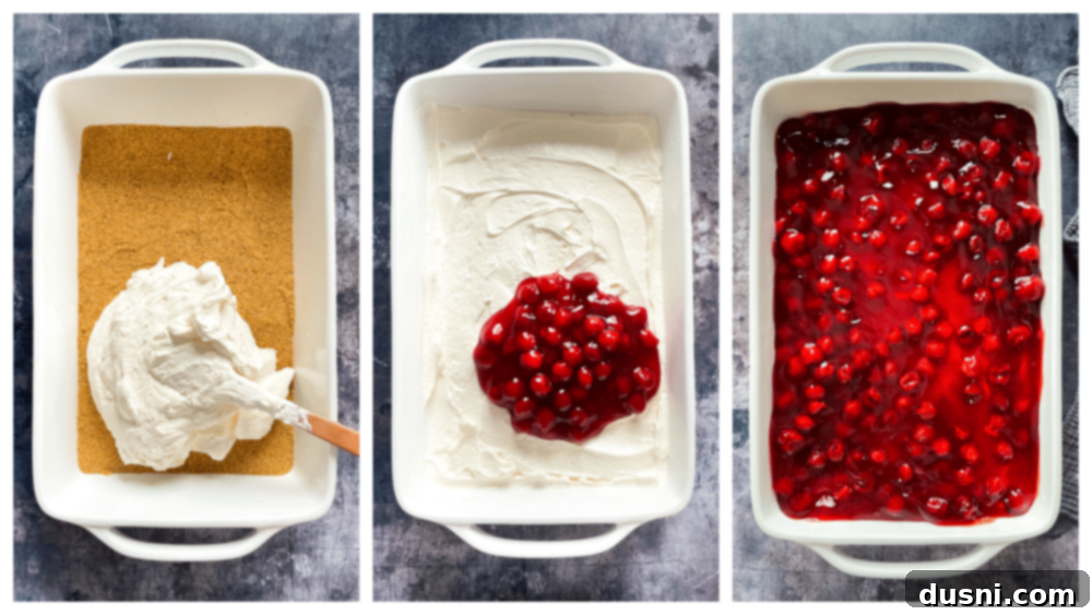 A visual progression of the dessert layers: graham cracker crust, creamy white filling being spread, and finally, cherry pie filling spooned on top.