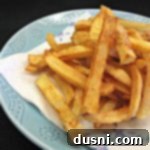 homemade french fries on a plate, ready to be eaten
