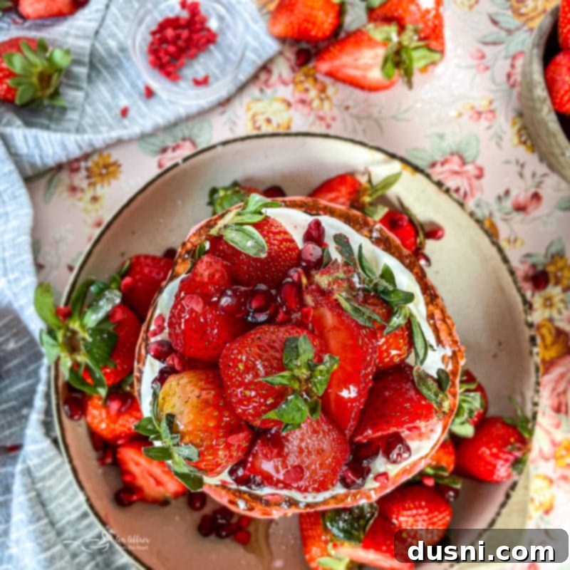 Various pancake toppings including maple syrup, fresh berries, and whipped cream.