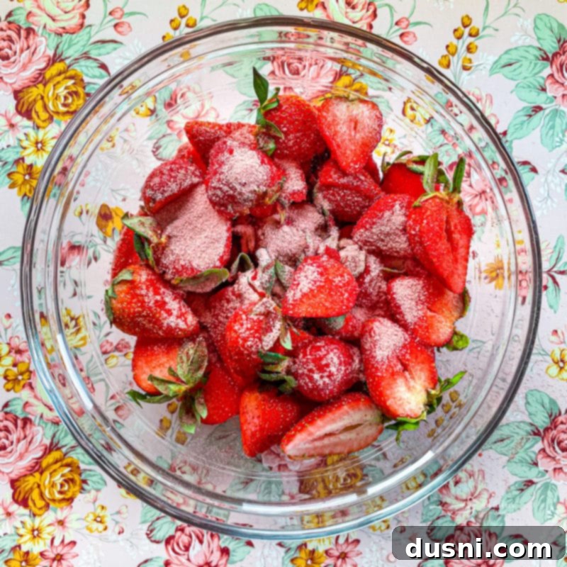 Dry ingredients for pancakes (flour, Jell-O, baking powder, salt) being whisked together in a bowl.