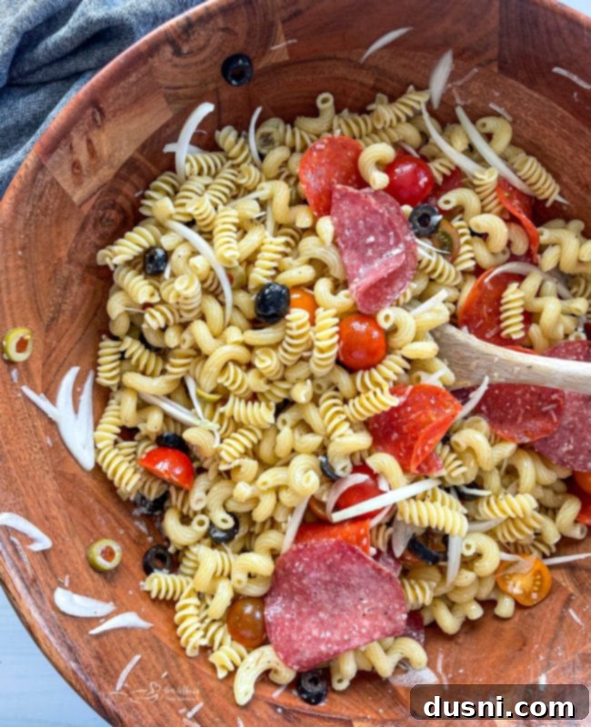 Italian Deli Pasta Salad 11 Top view of antipasto pasta salad in wooden bowl