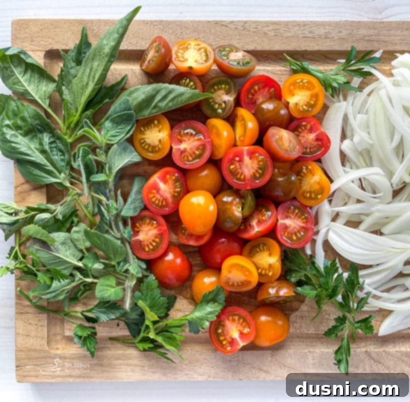 Italian Deli Pasta Salad 4 basil, tomatoes, and onions on wooden cutting board