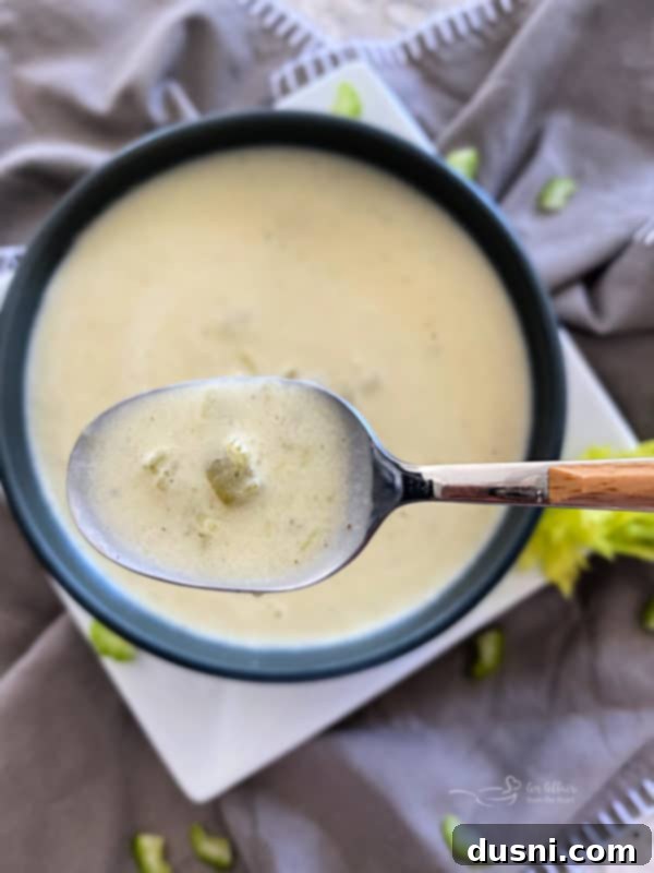 Homemade Cream of Celery Soup in a blue bowl