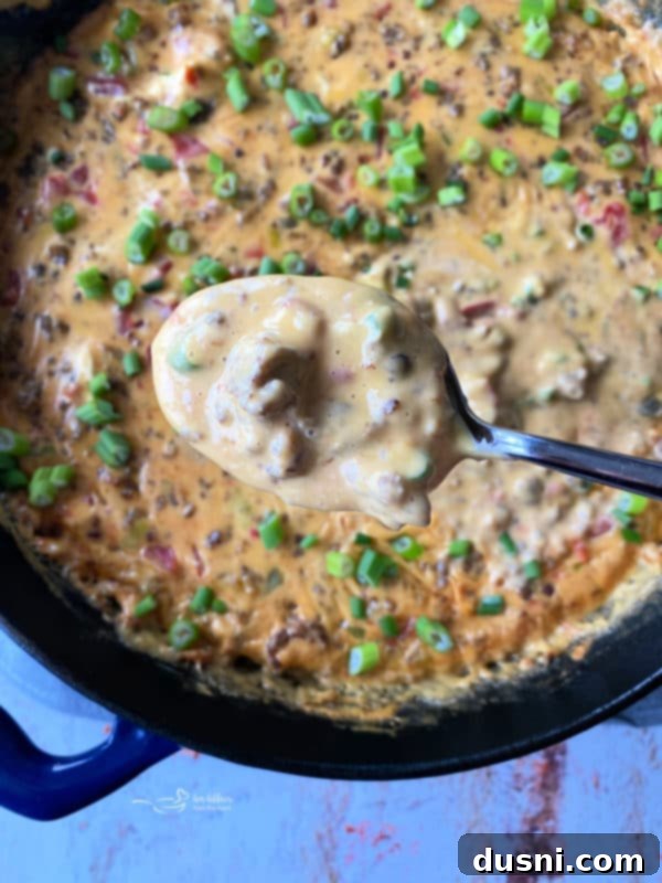 Golden Sausage & Cheese Fondue 6 Stirring the melted cheese and sausage dip