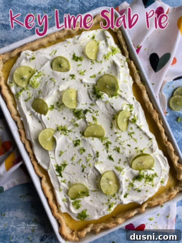 Zesty Key Lime Sheet Pie 16 Key Lime Slab Pie cut into squares and ready to be served, showing its creamy texture.