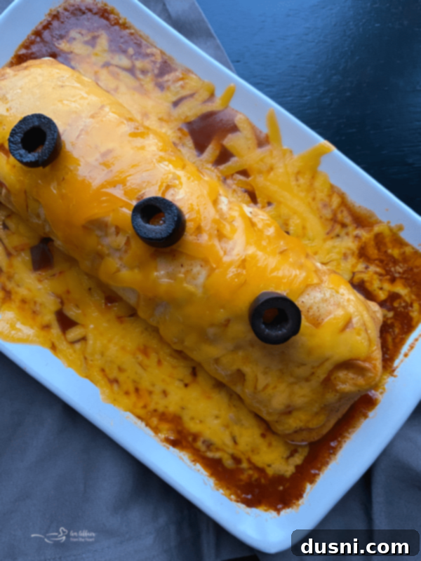 A delicious homemade Enchirito topped with sliced black olives, ready for serving.