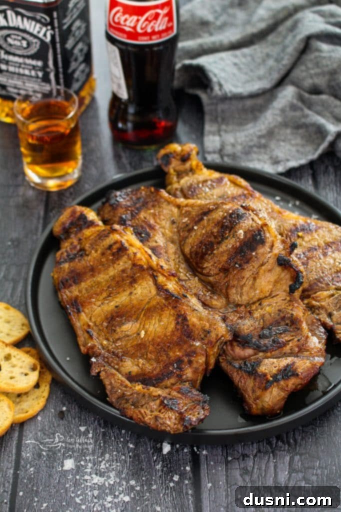 Jack Daniel's and Cola Glazed Steaks 2 Grilled Jack and Coke Steaks on a platter, ready to serve.