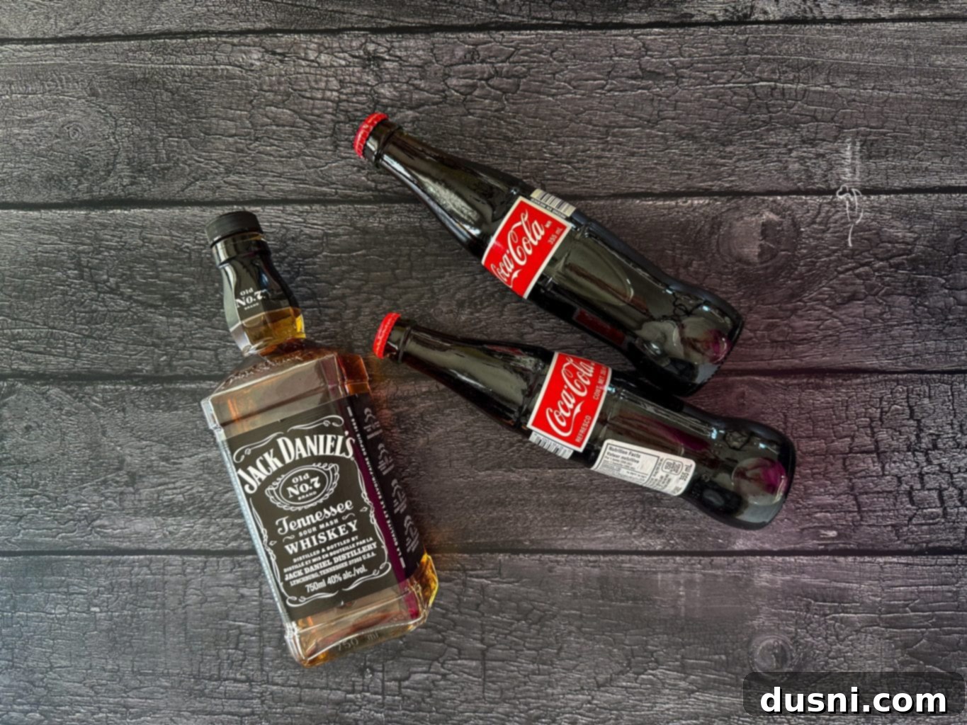 Jack Daniel's and Cola Glazed Steaks 4 Marinated raw New York Strip steaks in a ziploc bag.