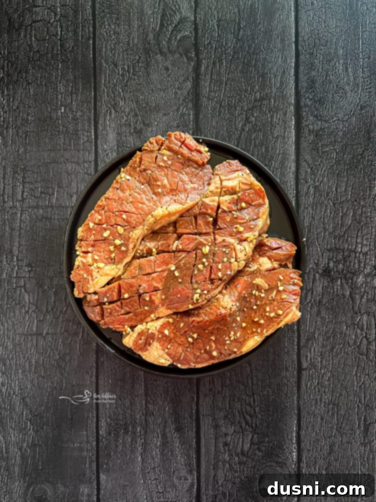 Jack Daniel's and Cola Glazed Steaks 9 Steaks removed from the refrigerator, resting on a plate.