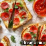 Pepperoni Pizza Grilled Cheese Melt 16 Pepperoni Pizza Grilled Cheese cut on white background