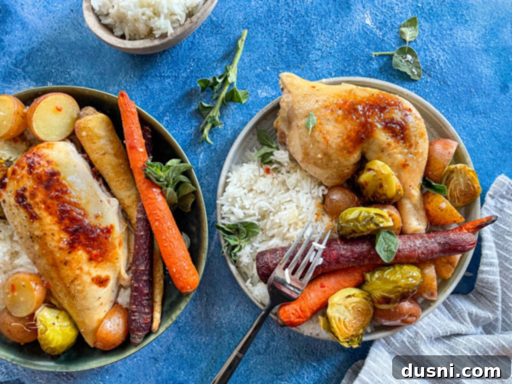 Two bowls of chicken with carrots, rice, potatoes, and Brussels sprouts