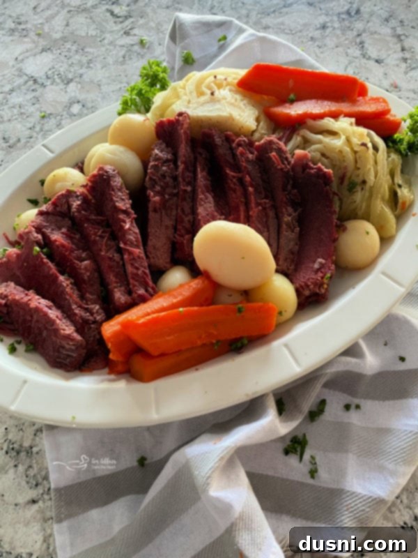 A serving of Instant Pot Corned Beef and Cabbage on a plate