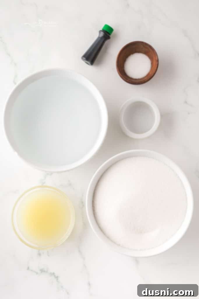 Scoops of homemade Baskin Robbins Daiquiri Ice in a bowl with fresh lime slices.