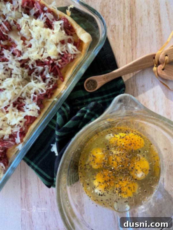 Reuben Crescent Breakfast Bake 7 Close-up of beaten eggs with caraway seeds and pepper