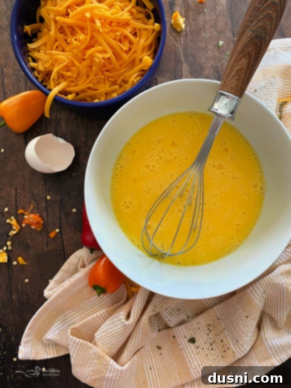 Sausage and vegetable mixture cooking in a skillet