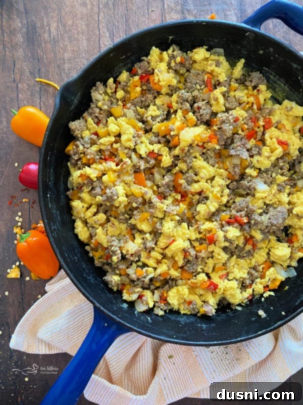 Beaten eggs in a bowl with a whisk