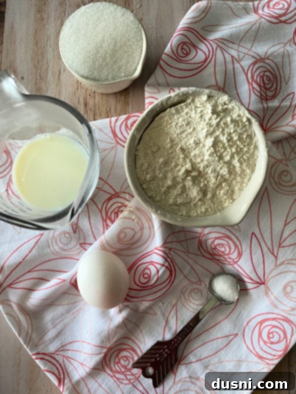 All ingredients laid out for making Russian Rose Bread: flour, butter, sugar, yeast, milk, water, egg, salt, and cinnamon