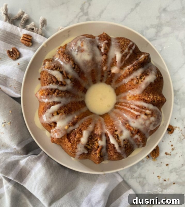 Drizzling vanilla sour cream glaze over a coffee cake