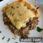 Hearty Swiss Mushroom Runza Bake 19 Square of Runza Casserole on a white plate