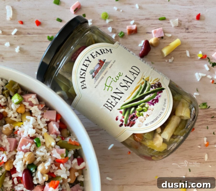 Five Bean Ham and Rice Salad 3 Overhead view of a Five Bean Ham & Rice Salad in a large bowl.