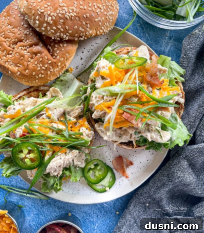 Crack chicken made in the pressure cooker on buns with green onions and jalapenos 