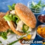 Top view of Instant Pot crack chicken on hamburger buns with lettuce