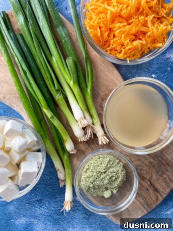Cream cheese, green onions, ranch dressing mix, chicken broth, and cheddar cheese