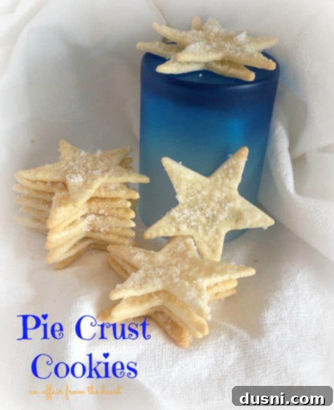 Star-shaped pie crust cookies arranged on a white cloth, text overlay 'pie crust cookies'