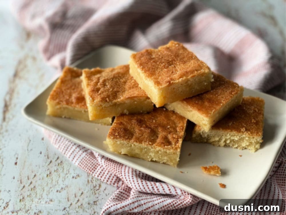 Front view of a stack of golden Dutch Letter bars on a white plate