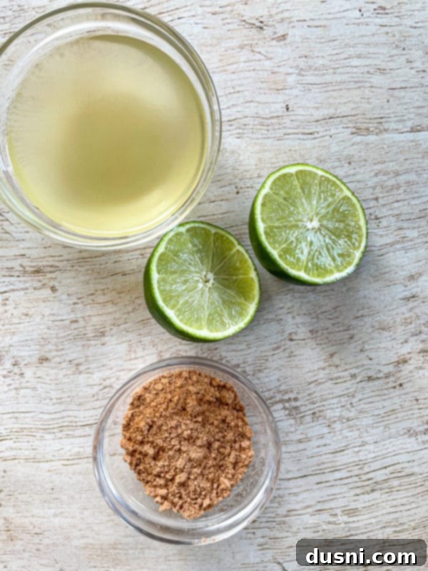 Fresh lime juice, whole limes, and a packet of taco seasoning, essential ingredients for the Slow Cooker Cilantro Lime Pork recipe.
