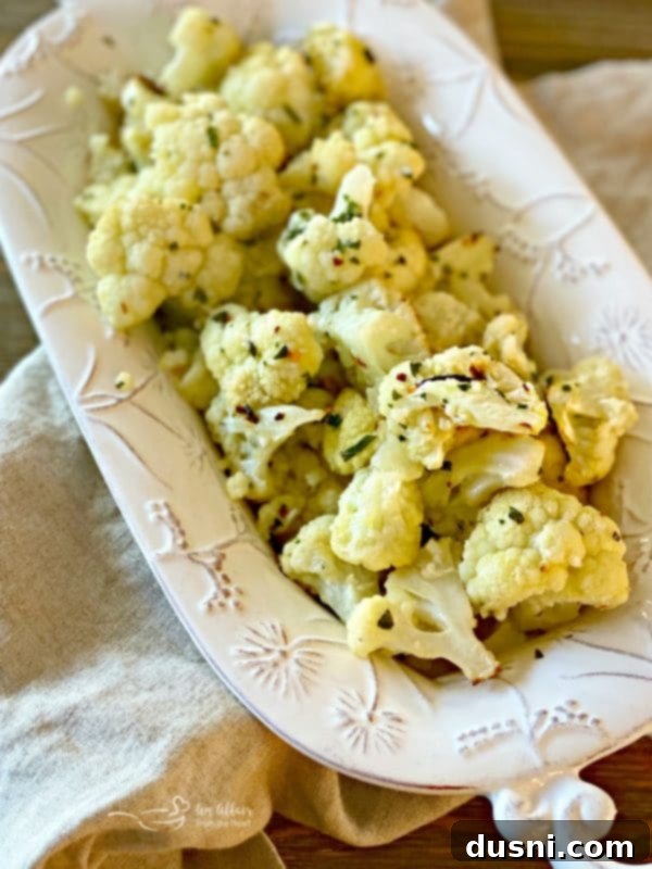 Oven Roasted Cauliflower seasoned with garlic, red pepper, and thyme